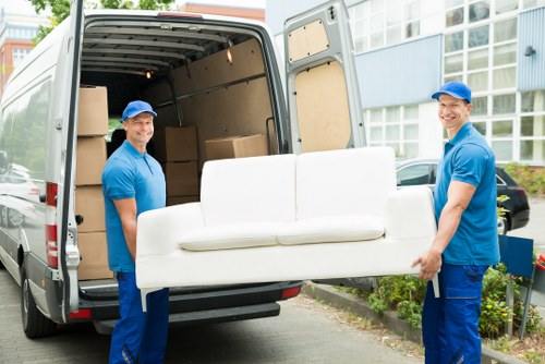 Careful loading of household furniture during a Merton removal
