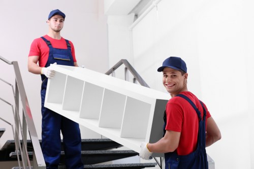 Student removal service moving boxes in Merton street with local residential housing
