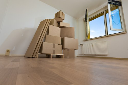 Moving home support in Merton with boxes and furniture being loaded carefully