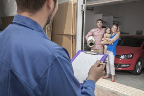 Moving boxes and household items from a flat in Merton