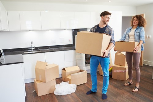 Furniture and boxes being loaded into a van for transport