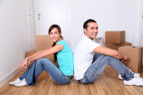 Packing team handling fragile items and furniture for a Merton relocation