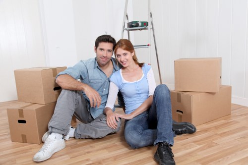 Removal van transporting household items through a Merton neighbourhood