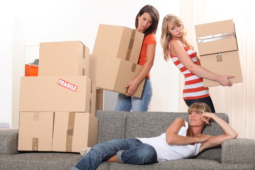 Removal van and moving crew handling a local move in Merton