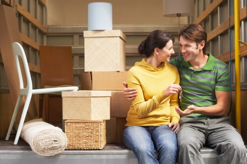 Packed boxes and furniture ready for a home relocation in Merton